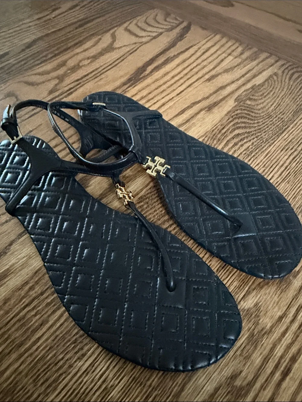 Tory Burch Black Quilted Leather T-Strap Sandals with Gold Logo Hardware